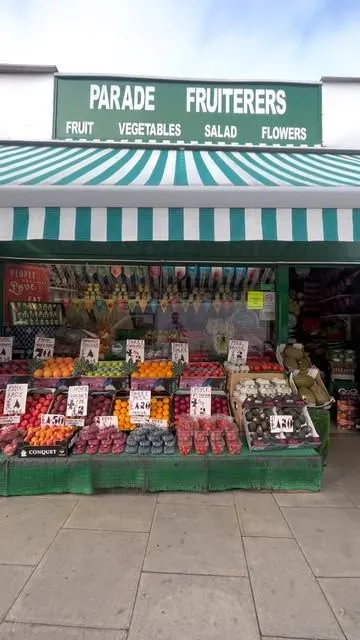 Parade Fruiterers shop front with its green and white striped awning, St John's Parade, West Ealing